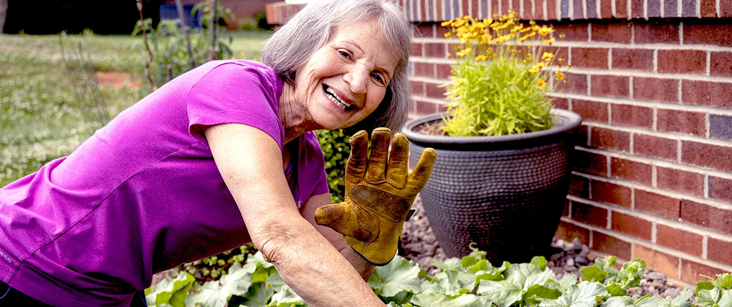 A resident tending a garden