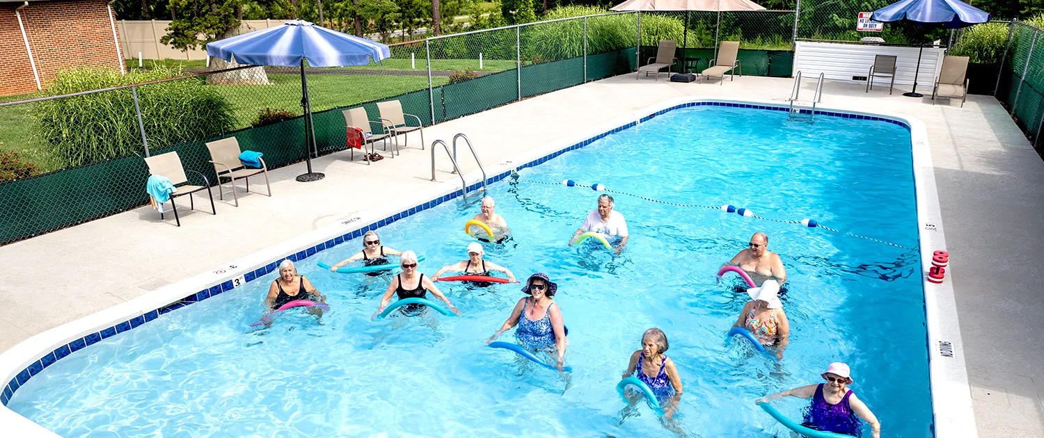 Residents taking water aerobics together